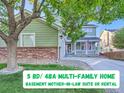 Inviting two-story home with a covered porch, mature trees, and well-maintained front yard at 2865 S Yampa Way, Aurora, CO 80013