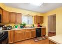 Well-lit kitchen features ample counter space, modern appliances, and wood flooring at 7755 E Quincy Ave # T80, Denver, CO 80237