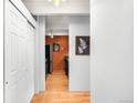 View of the Kitchen area featuring wood floors and stainless steel appliances at 1365 Columbine St # 301, Denver, CO 80206