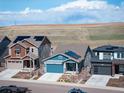 Charming two-story homes with solar panels sit atop a sunny landscape at 8346 Mount Kataka St, Littleton, CO 80125