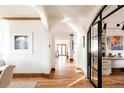 Bright hallway with hardwood floors, arched doorways and modern office at 1275 S Elizabeth St, Denver, CO 80210