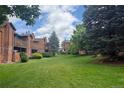 View of the building complex, showing well-maintained grounds and mature trees, enhancing curb appeal at 2261 S Buckley Rd # 102, Aurora, CO 80013
