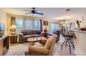 Inviting living room with plush seating, ample natural light, and an open layout at 12835 Mayfair Way # C, Englewood, CO 80112