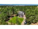 Secluded home on wooded lot with long driveway and plenty of space at 6650 Village Rd, Parker, CO 80134