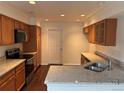 Well-lit kitchen boasts granite countertops and stainless steel appliances at 20000 E Mitchell Pl # 35, Denver, CO 80249