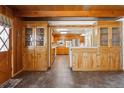 Bright dining room with built in cabinets and views of the kitchen at 209 S 13Th Ave, Brighton, CO 80601
