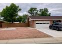 This home boasts a spacious garage and a large driveway for ample parking at 209 S 13Th Ave, Brighton, CO 80601