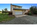 Well-maintained home featuring a spacious two-car garage with a concrete driveway at 4627 Cathy Ln, Erie, CO 80516