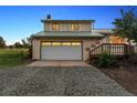 Well-maintained home with a two-car garage and a charming front yard at 4627 Cathy Ln, Erie, CO 80516