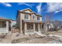 Charming two-story home with a covered front porch and drought resistant landscaping at 3793 Cadence Dr, Castle Rock, CO 80109