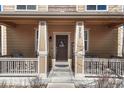 Inviting front porch featuring a decorative door and seating at 3793 Cadence Dr, Castle Rock, CO 80109