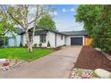 Beautiful one-story home with a private driveway and well-maintained lawn at 5553 S Datura St, Littleton, CO 80120