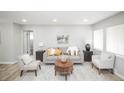 Inviting living room with neutral tones, comfortable seating, and bright natural light, perfect for relaxation at 1150 S Taos Way, Denver, CO 80223
