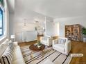 Bright living room with hardwood floors, neutral decor, and stylish furniture at 542 Hawthorn Cir, Frederick, CO 80530