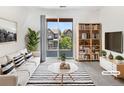 Bright living room with stylish furnishings and a view of the outdoors at 4100 Albion St # 523, Denver, CO 80216