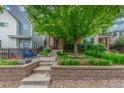 Charming home exterior with a landscaped front yard, cozy seating area, and inviting curb appeal at 3322 W 26Th Ave, Denver, CO 80211