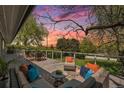 Enjoy outdoor living on this spacious deck with comfortable seating and scenic views at sunset at 6150 S Southwood Dr, Centennial, CO 80121