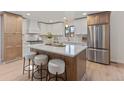 Spacious kitchen with a large island, ample cabinet space, and stainless steel appliances, perfect for entertaining at 41 Eagle Dr, Littleton, CO 80123