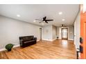 Spacious living room featuring hardwood floors, recessed lighting, and a ceiling fan at 1945 Yosemite St, Denver, CO 80220