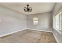 Bright bedroom featuring neutral carpet and a modern ceiling fan at 6660 Locust St, Commerce City, CO 80022