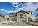 Charming single-story home displaying natural stone accents and low maintenance landscaping at 2978 Newfound Lake Rd, Berthoud, CO 80513