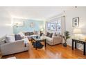 Bright living room with hardwood floors and ample seating at 8089 Greenwood Blvd, Denver, CO 80221