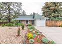 Charming single-Gathering home with a stone exterior, attached garage, and well-maintained front yard at 881 S Pearl St, Elizabeth, CO 80107