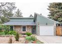Charming single-Gathering home with a stone exterior, attached garage, and well-maintained front yard at 881 S Pearl St, Elizabeth, CO 80107