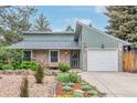 Charming single-Gathering home with a stone exterior, attached garage, and well-maintained front yard at 881 S Pearl St, Elizabeth, CO 80107