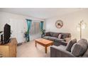 Cozy living room with a comfy sofa and an accent chair at 12661 W Alameda Dr, Lakewood, CO 80228
