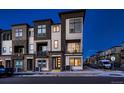 Modern townhome with a multi-tone exterior, private balconies, well-manicured landscaping, and dedicated parking at 375 Marshall Rd, Superior, CO 80027