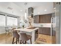 Modern kitchen with stainless steel appliances and an island at 3026 Zuni St, Denver, CO 80211