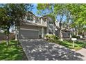 Lovely two-story home featuring a spacious driveway, attached two-car garage, and beautifully landscaped front yard at 9690 Lansing Cir, Commerce City, CO 80022