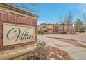 Welcome to the Villas at Highland Park brick entrance sign with manicured landscaping at 8977 E Otero Pl, Centennial, CO 80112