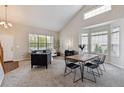 Bright, modern living room with high ceilings, a bay window, and stylish furniture at 6519 Eastview St, Longmont, CO 80504