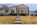 Charming single-Gathering home featuring a welcoming front porch, well-maintained landscaping, and a cozy curb appeal at 20764 E 47Th Ave, Denver, CO 80249