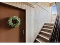 Warm entryway with wood paneling and stairway at 203 Wright St # 102, Lakewood, CO 80228