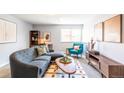 Inviting living room featuring a comfortable sofa, a bright window, and a classic layout perfect for relaxing at 1260 York St # 204, Denver, CO 80206