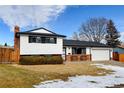 Charming two-story home featuring a well-maintained lawn, brick accents, and an attached two-car garage at 315 E 112Th Dr, Northglenn, CO 80233