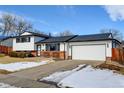 Charming two-story home featuring a well-maintained lawn, brick accents, and an attached two-car garage at 315 E 112Th Dr, Northglenn, CO 80233