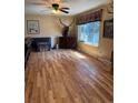 Bright living room with hardwood floors, a ceiling fan, and lots of natural light at 4827 S Lewis Ct, Littleton, CO 80127