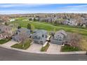 Inviting home overlooking a golf course, featuring an attached garage and a well-maintained lawn at 13420 Lafayette St, Thornton, CO 80241