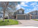 Charming two-story home with a well-kept lawn, two-car garage and a basketball hoop at 13420 Lafayette St, Thornton, CO 80241