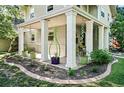 Inviting front porch adorned with planters and decorative accents, enhancing curb appeal at 751 Poplar St, Denver, CO 80220