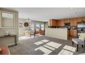 Open living area with kitchen and dining space at 9760 Mayfair St # A, Englewood, CO 80112