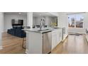 Spacious kitchen island with seating and modern stainless steel appliances at 2111 S Franklin St, Denver, CO 80210