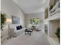 Bright living room featuring a fireplace, built-in shelves, and large windows at 946 Champion Cir, Longmont, CO 80503