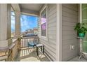Inviting front porch with seating and ample space for relaxing and enjoying the neighborhood views at 4884 St Vrain Rd, Firestone, CO 80504