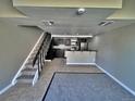 Living room with stairs, stainless steel appliances and gray walls at 371 S Estes St # 10, Lakewood, CO 80226