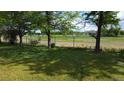 View of the fenced backyard backing to a park and track; perfect for those who appreciate nature and outdoor activities at 7170 W Mississippi W Ave, Lakewood, CO 80226